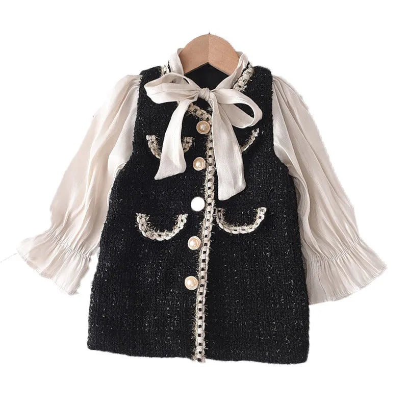 Children's black princess dress with long sleeves and stitching design on polyester fabric