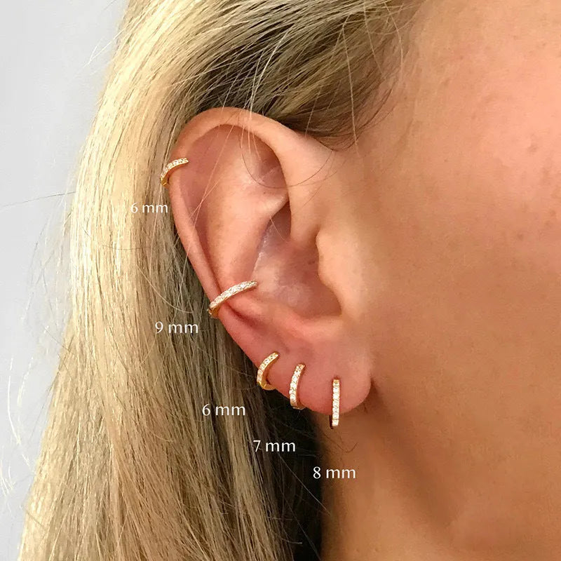 Circle zircon perforated stud earrings in gold, rose gold, and silver colours with geometric design