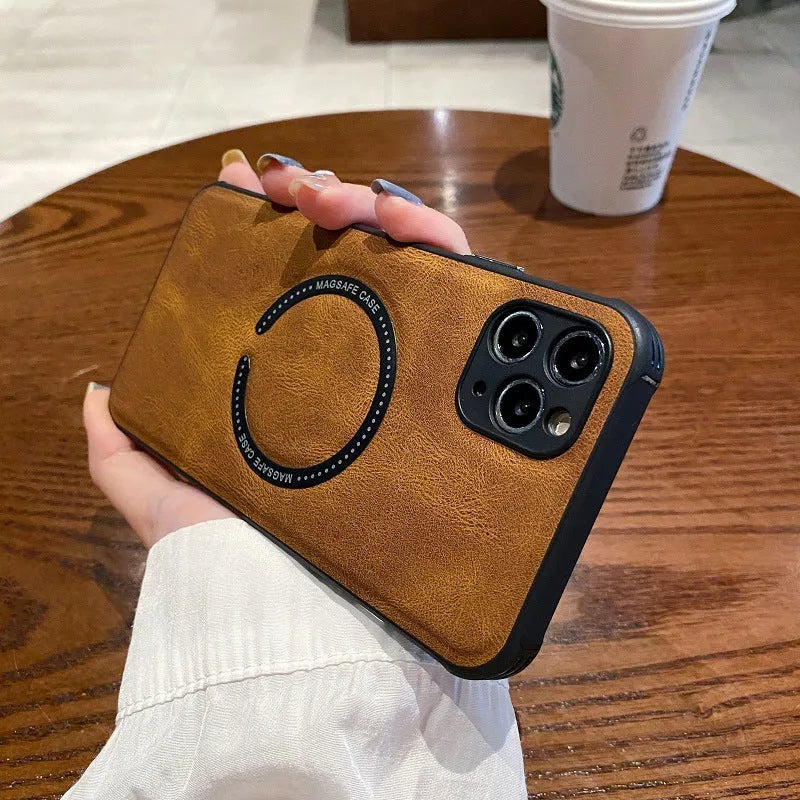 Black imitation leather magnetic charging case for Apple iPhone on a table.