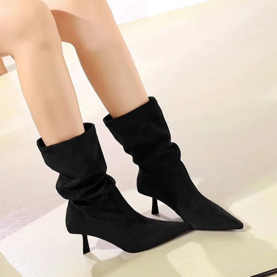 Mid-calf pointed toe stiletto heel boots in dark brown with elastic pleated pile style and sewing line detail.