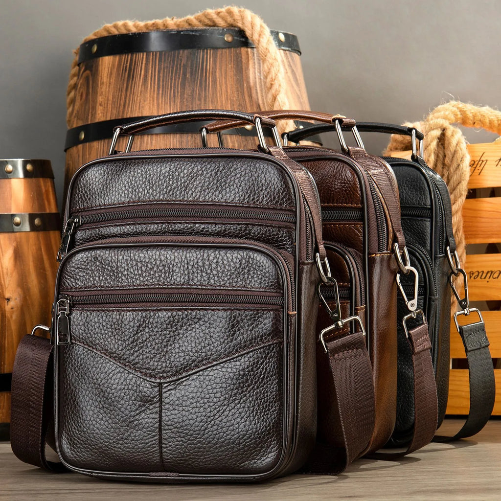 Men's top grain leather crossbody bag in brown with stitching detail and expandable side panels