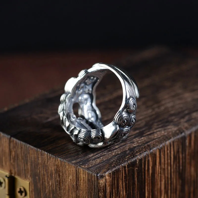 Silver open style ring showing Domineering Jibeast pattern with zodiac animal modelling