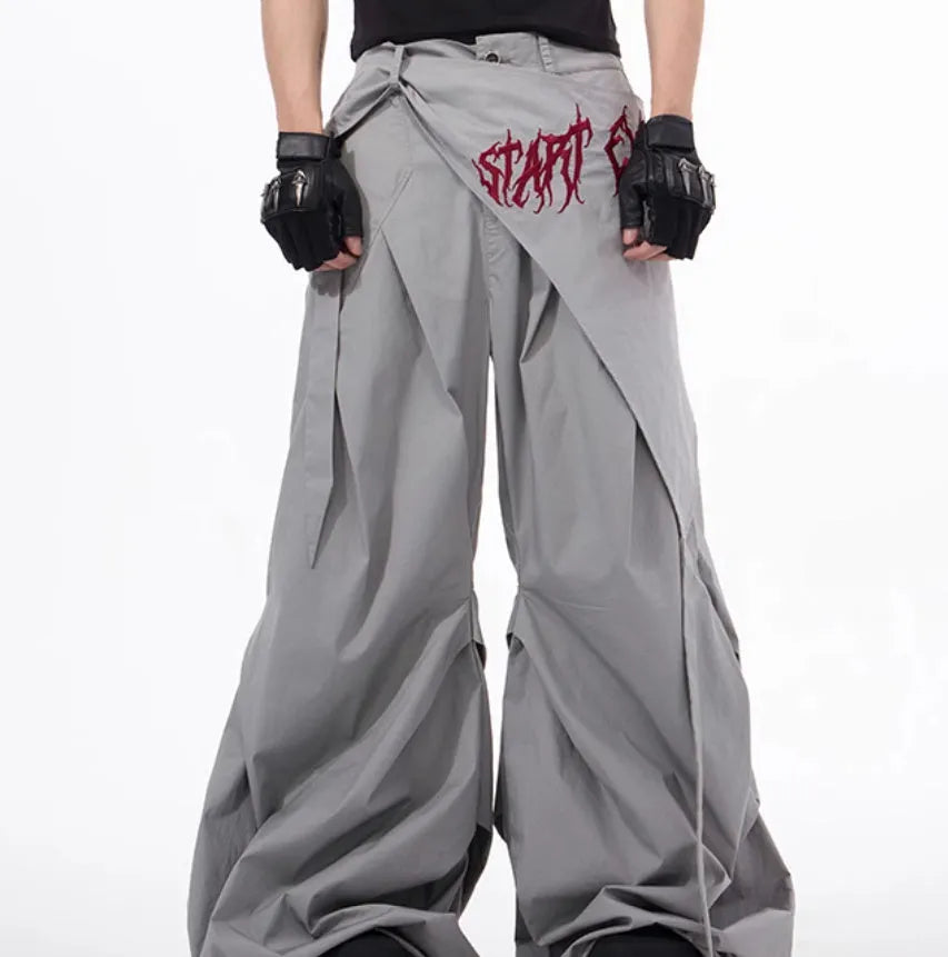 Boy modelling black wide-leg summer trousers with a relaxed fit and Korean-inspired style.