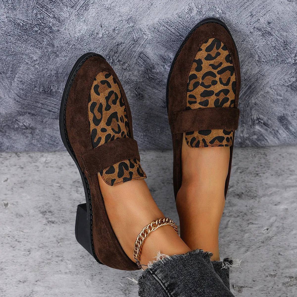 Leopard print suede slip-on pumps with a chunky heel and pointed toe in pink, brown, and khaki.