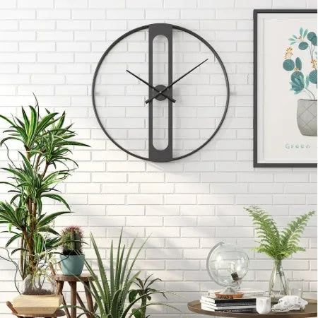 50 cm round metal wall clock on a wall in black and gold colour options