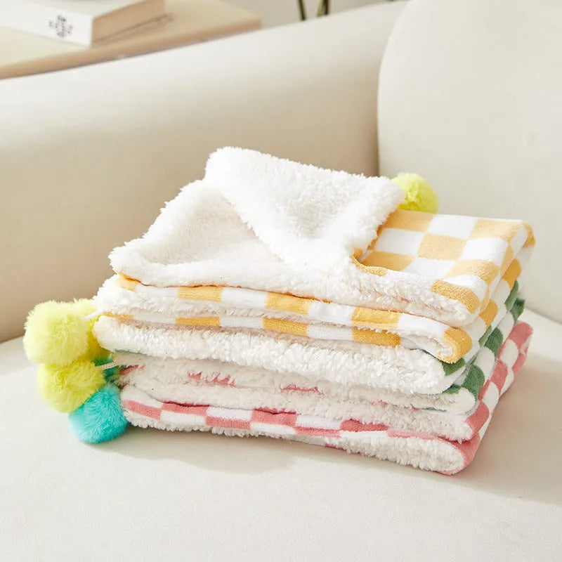 Green plaid pet blanket with soft fleece surface for cats and dogs