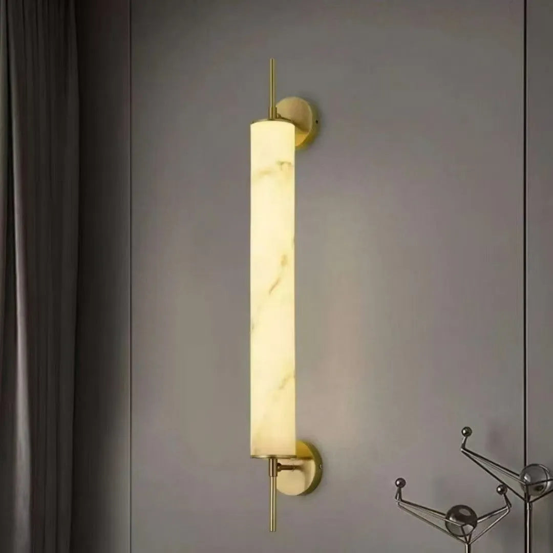 Marble wall lamp with warm light, black finish, 50cm long, mounted on a living room wall