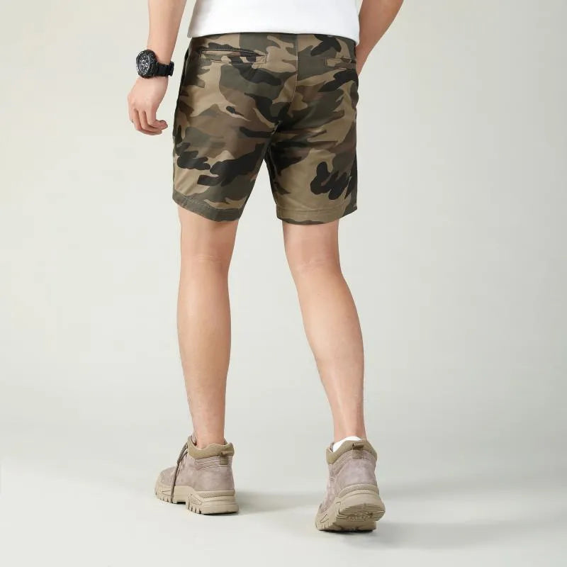 Men's green camouflage cotton workwear shorts with zip fly on a mid waist.