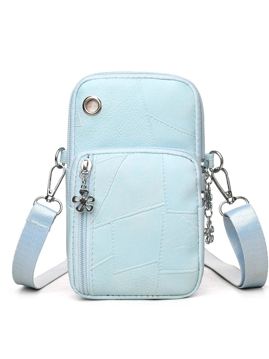 Vertical square mini mobile phone bag in PU leather with an exterior sandwich pocket.