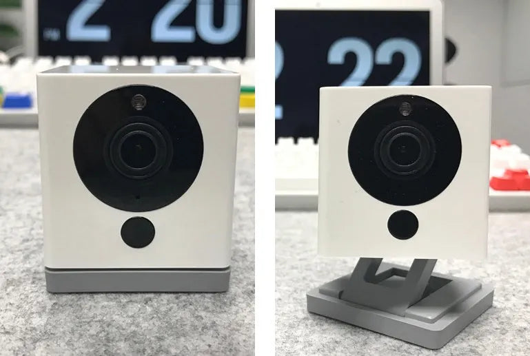 White compact indoor night vision security camera with 1080P resolution and 110° wide-angle lens on a shelf