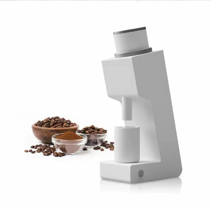 Electric coffee grinder with inclined aluminium alloy body in white on a countertop for home or office use