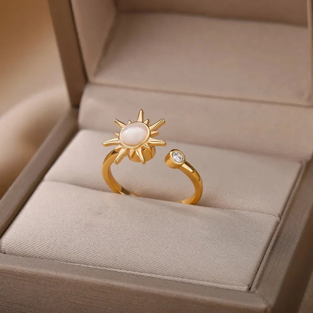 Gold and platinum adjustable geometric decompression spinner rings showing rotatable design