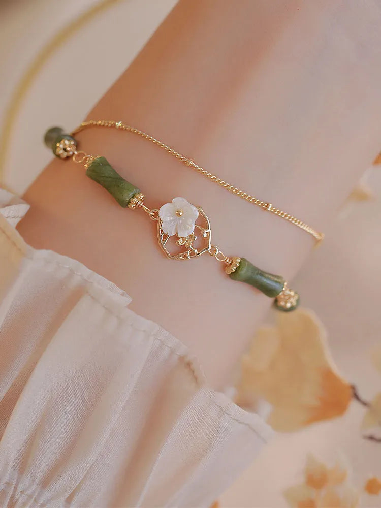 Natural olivine double layer bracelet with braided cord and Bells of Ireland design
