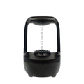 Anti-gravity humidifier with water droplet effect on desk next to USB cable