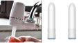 White plastic faucet water filter unit with ceramic core and universal thread adapters for kitchen tap installation.