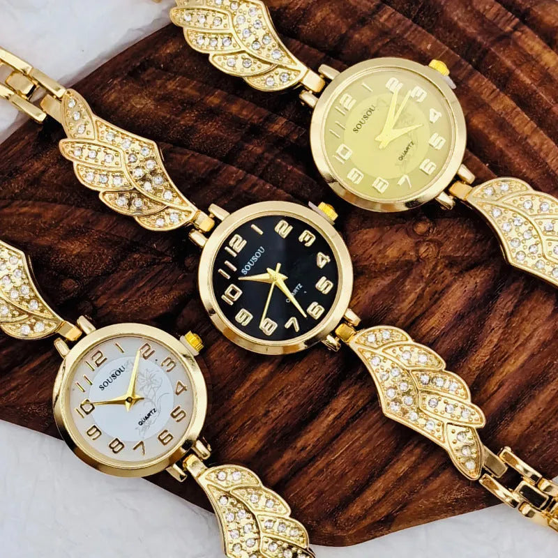 Women's stainless steel watch with round dial showing gold surface colour and vachette clasp