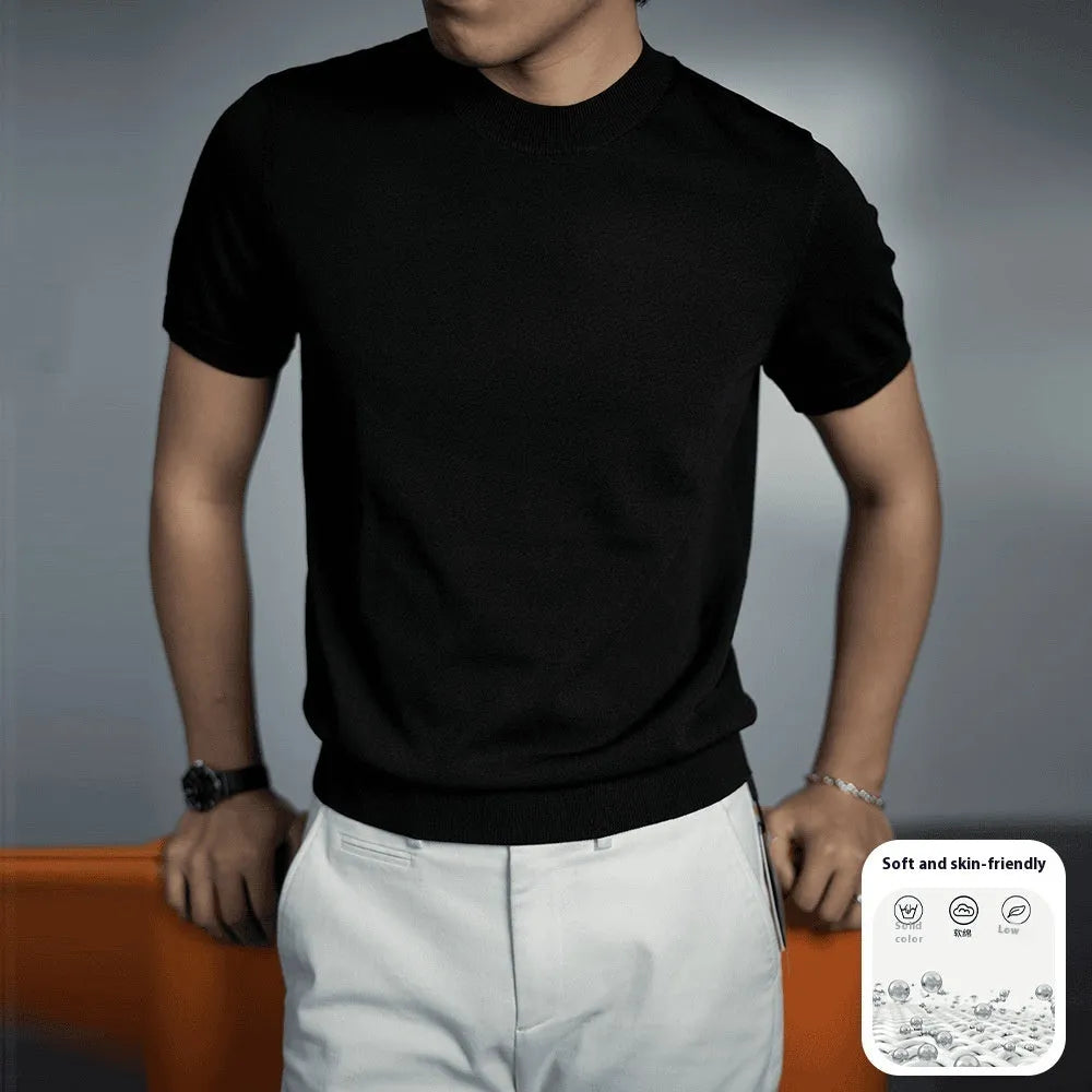 Man wearing a silver grey knitted round neck t-shirt with short sleeves.