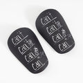 A pair of white and black PU football shin guards for S and XS sizes.