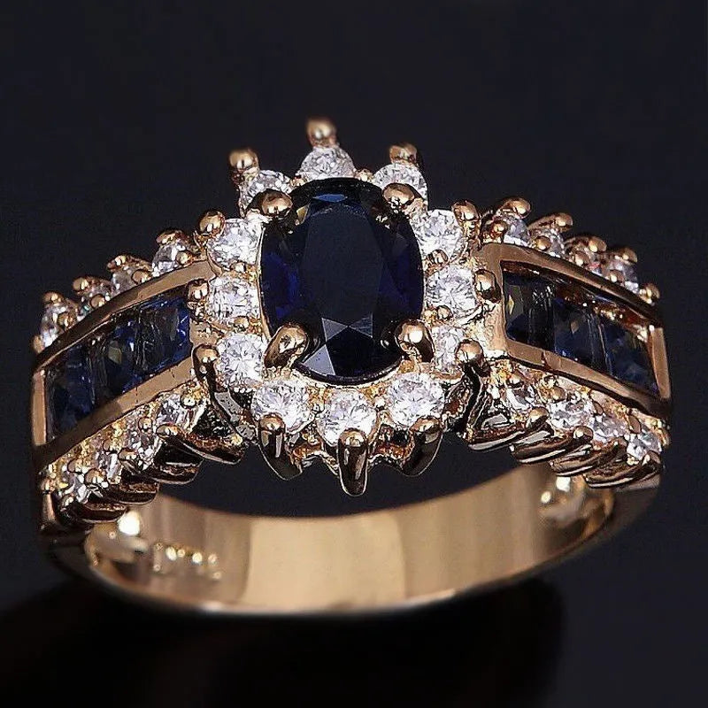 Personalised zinc alloy unisex ring in sunflower blue diamond and square zircon designs on a size chart.