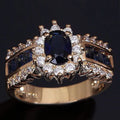 Personalised zinc alloy unisex ring in sunflower blue diamond and square zircon designs on a size chart.