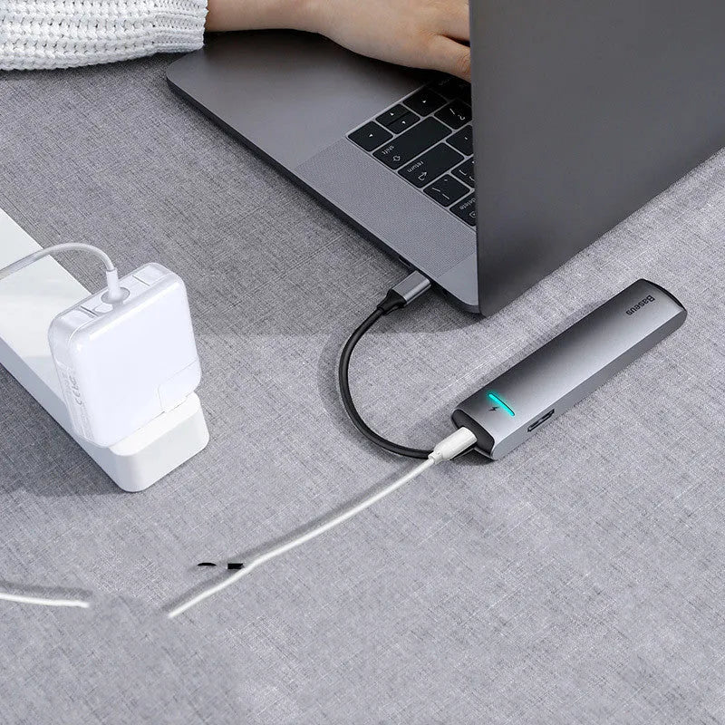 Dark grey Type-C docking station with mechanical eye design compatible with Apple MacBook and iPhone