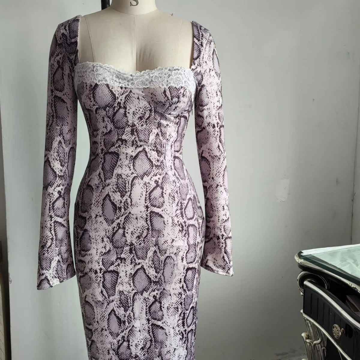 Grey women's slim fit lace dress with long sleeves and a digital 3D printed pattern on an A-line skirt.
