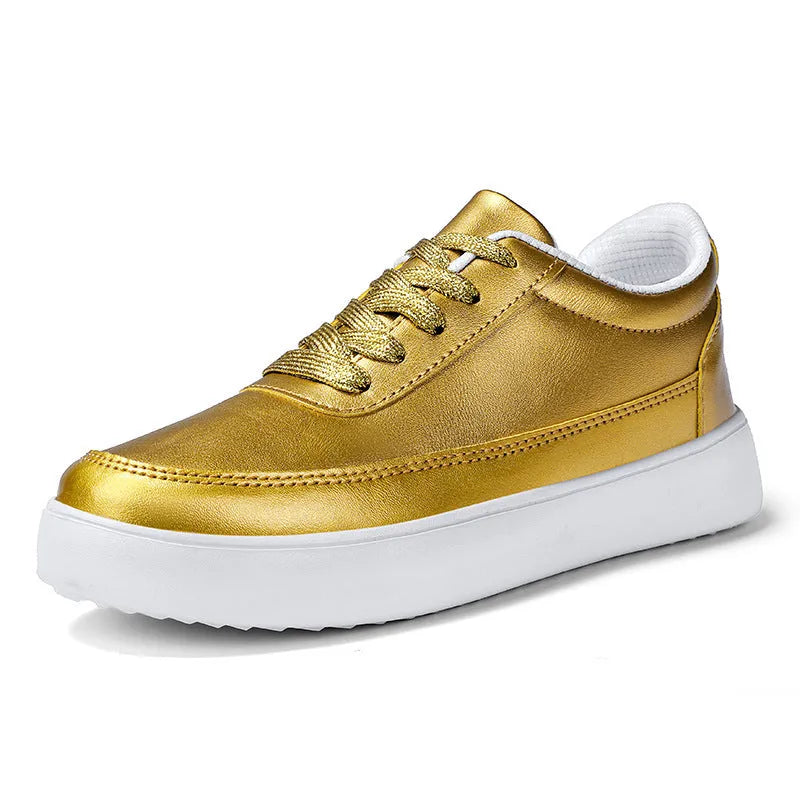 Women's white leather flat lace-up casual shoes on a plain background.