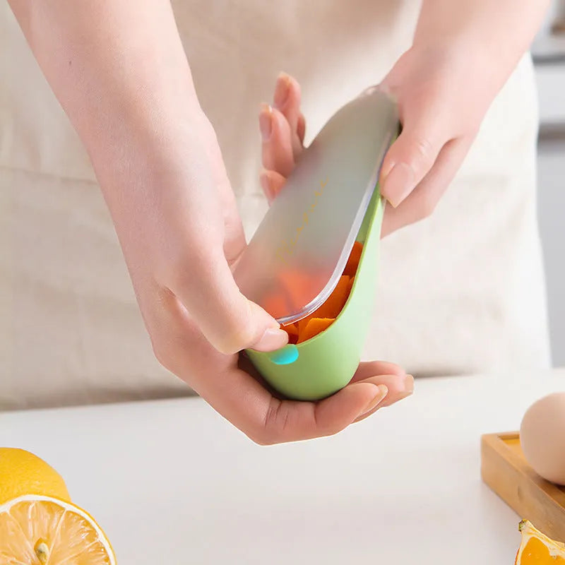 Dark green kitchen peeler with storage tube and stainless steel blade for fruit and vegetable peeling