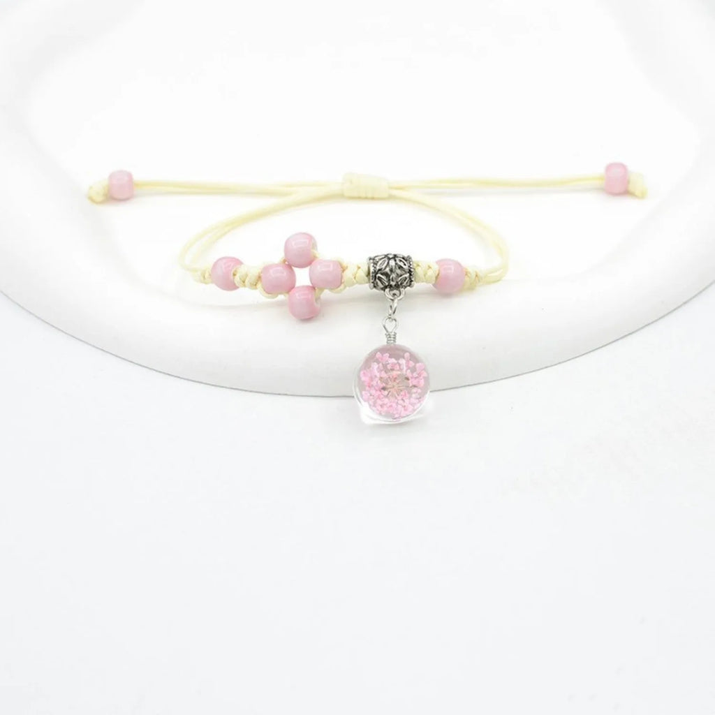 Glass dried flower bracelet with hand-woven beads containing real preserved flowers in various colours