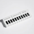 Black and white piano-shaped plastic parking sign measuring 148mm × 150mm × 48mm for temporary vehicle spaces