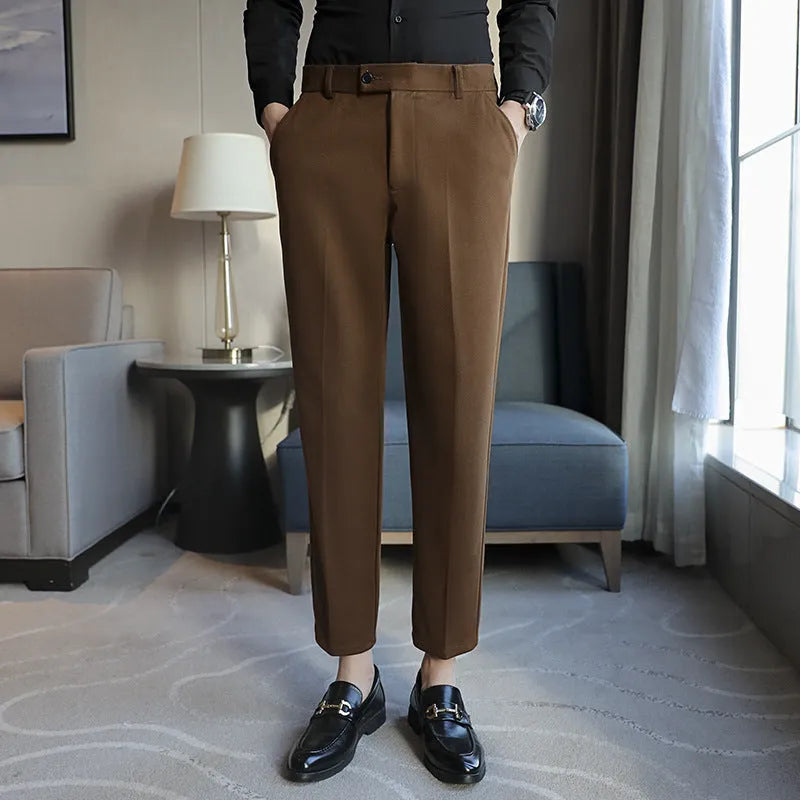 Straight retro brown corduroy trousers with elastic waistband on hanger
