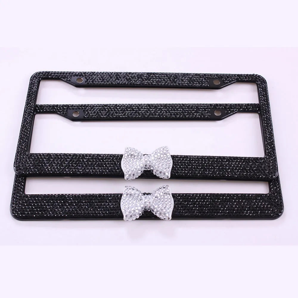 Stainless steel rhinestone license plate frame with hand-set diamonds, 31x6x1.5cm, in black, pink or white.