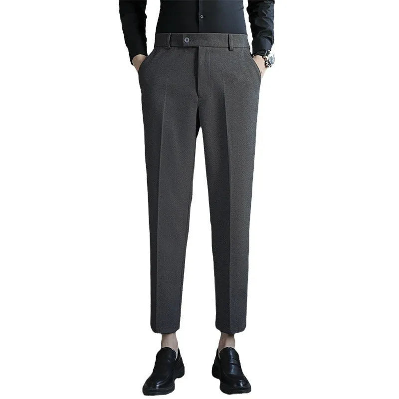 Straight retro brown corduroy trousers with elastic waistband on hanger