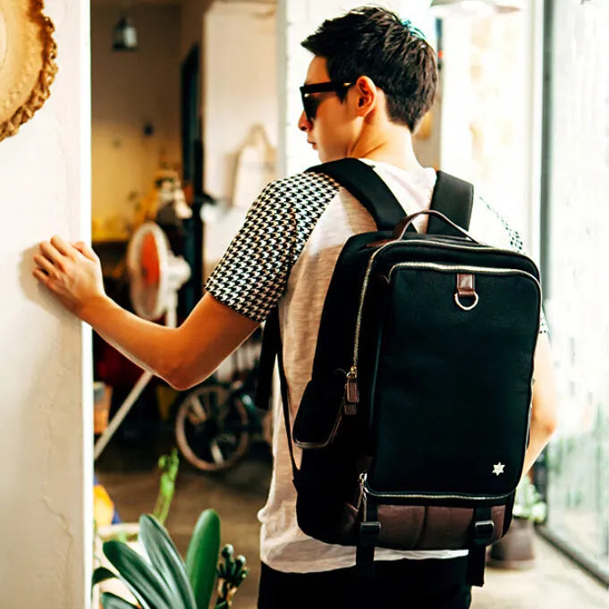Modern Korean-style men's backpack in Oxford cloth showing large capacity and available colour options.