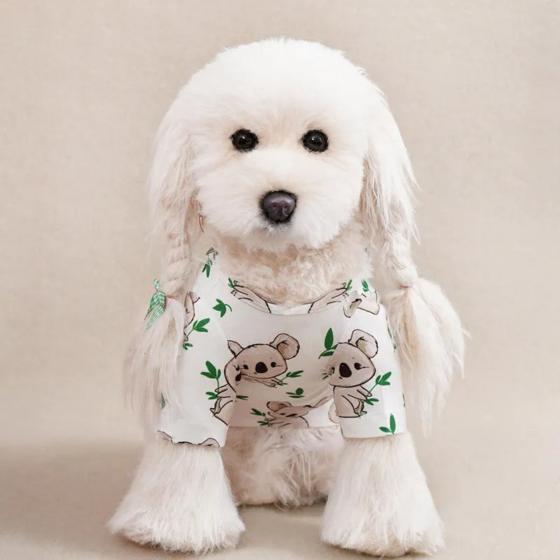 Colourful printed polyester t-shirt for a small dog, showing size chart with chest and length measurements.