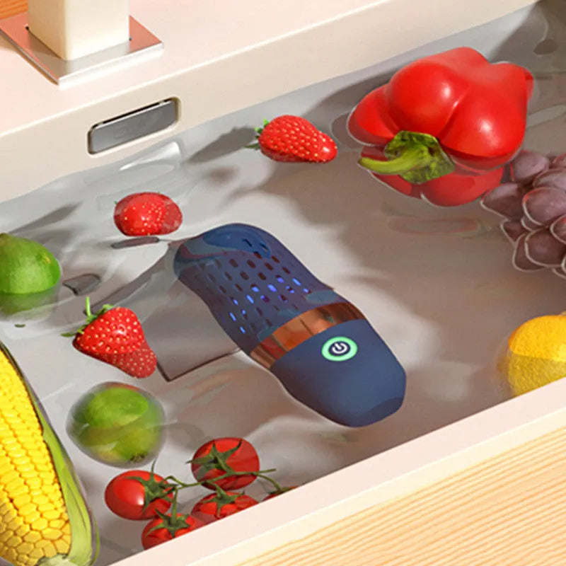 Blue capsule fruit and vegetable purifier with USB charger on a kitchen countertop