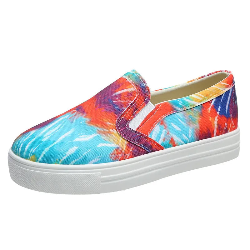 Women's blue low-top canvas sneaker with flat rubber sole on a plain background.