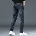 Men's slim straight casual trousers in thin polyester fabric available in black and blue grey colours