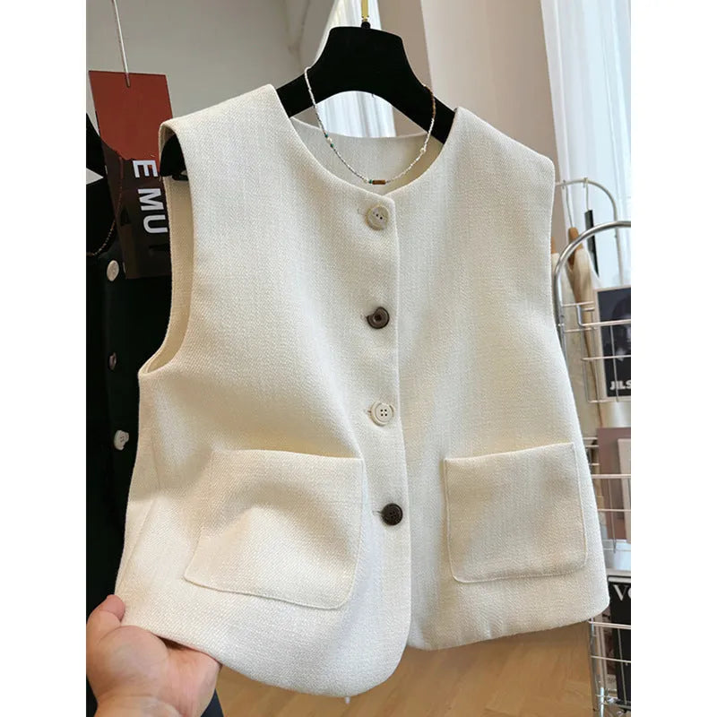 Women's sleeveless round neck vest in black, showing French bandage dress style.