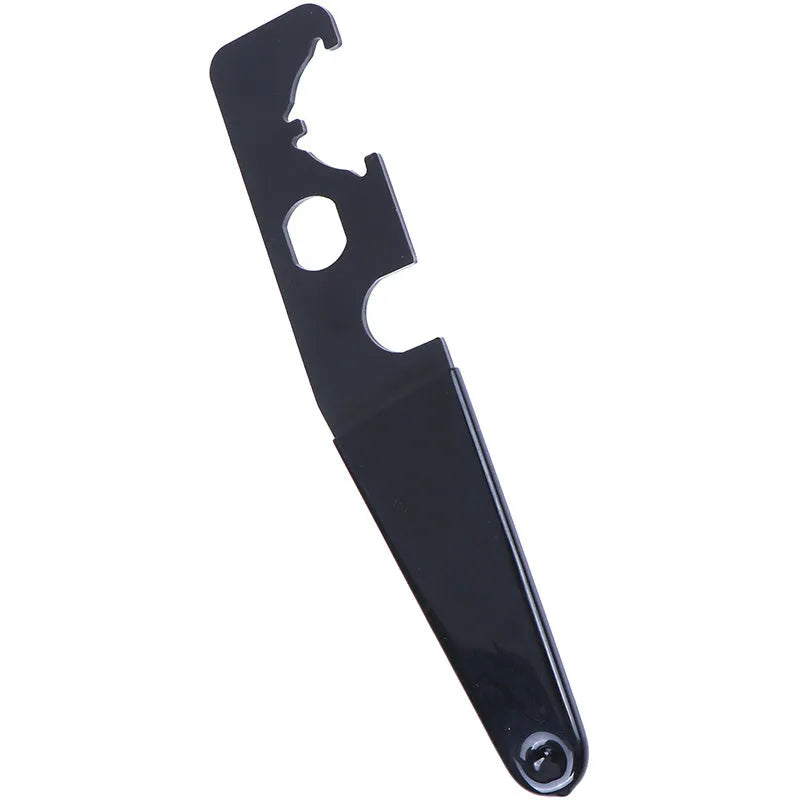 Black steel and rubber multi-function tactical wrench on dark surface showing slim 20.8cm profile