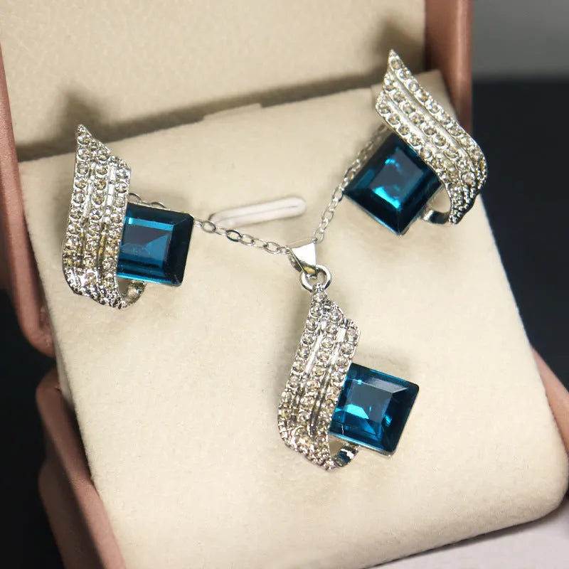 Glass pendant on alloy cross chain necklace with matching electroplated earring studs set