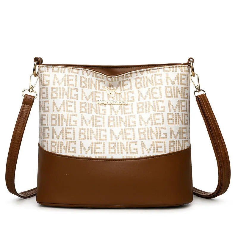 Brown soft leather messenger bag with front pocket and shoulder strap