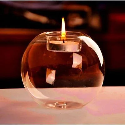 Clear round hollow handmade glass candle holder in European style on a table