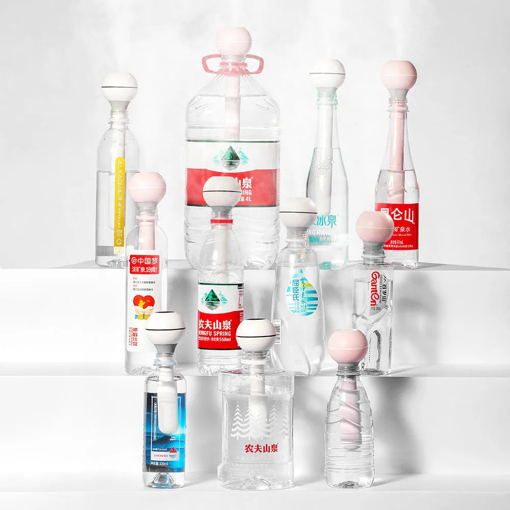 Columnar magic wand style personal humidifier with a 1 litre water tank and mechanical control knob.