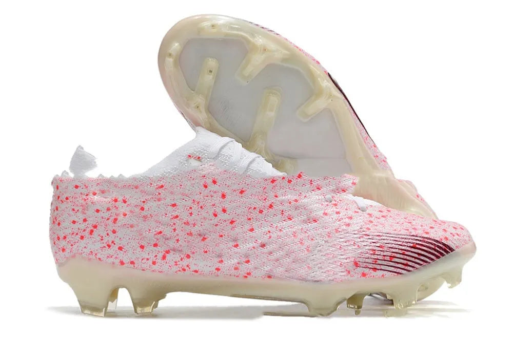 Men's low-top waterproof knitted football shoes with FG studs on a rubber sole