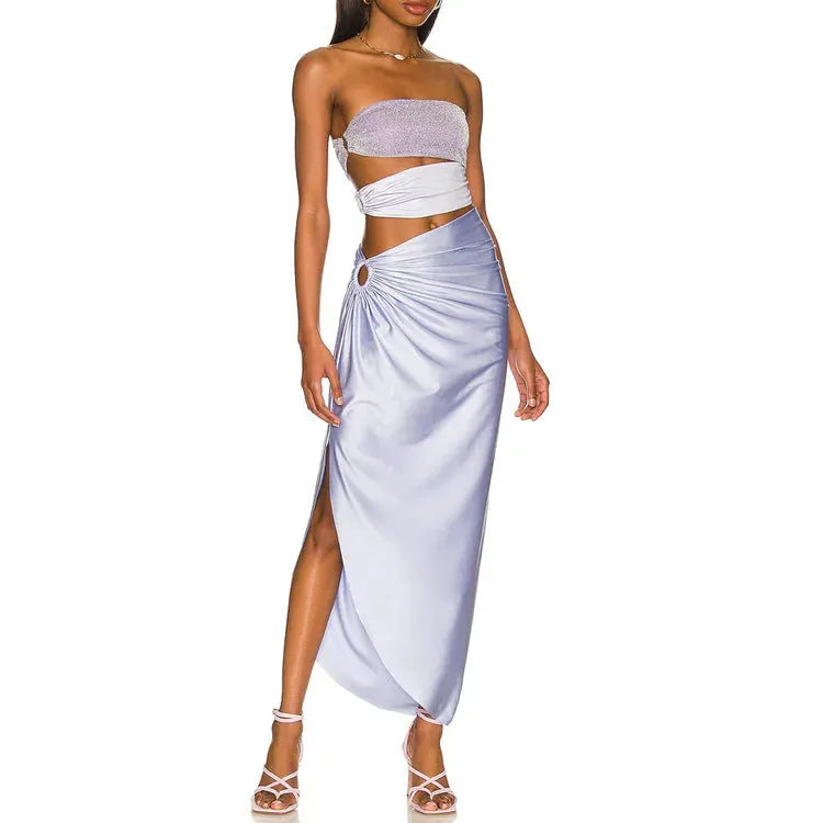 Purple women's one-piece swimsuit with hollow design and matching wrap skirt on mannequin