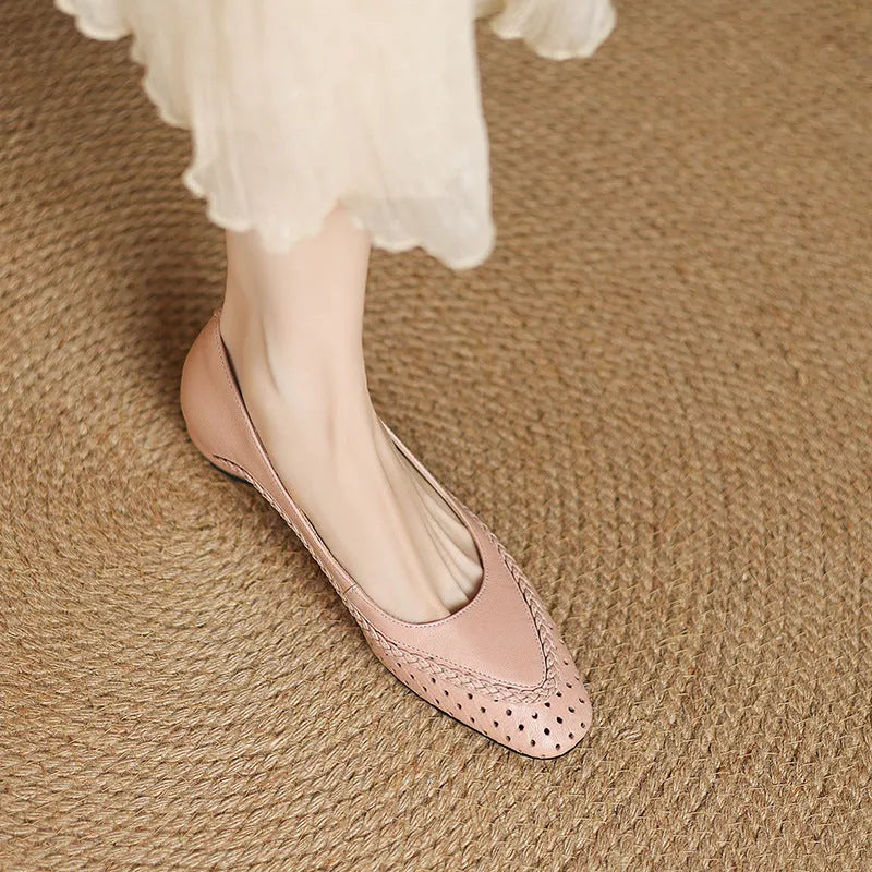 Women's beige sheepskin sandals with hollow-out design, round toe, and mid heel.