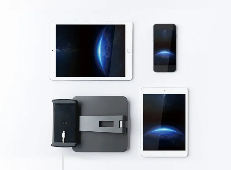 Silver aluminium folding phone and tablet stand on a desk, holding a tablet