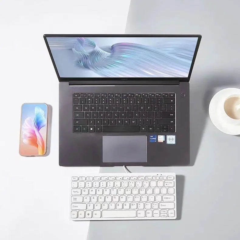 USB wired mini keyboard in four colours: black, white, pink, blue with compact design