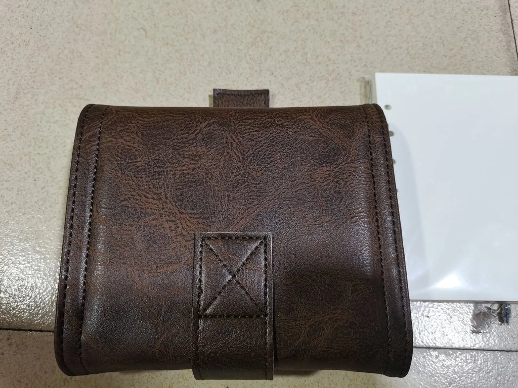 Brown A7 size notebook with a retro PU cover and leather buckle, showing loose-leaf binding.